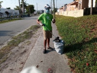 Florida Power & Light Company (FPL) employee Lucretia Allen and her nephew helped pick up litter and keep their community clean in North Miami, Fla., in honor of Earth Day. The litter pickup was done with the help of a Power to Clean kit they received fro