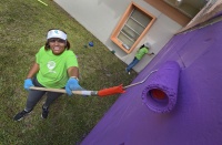 Florida Power & Light Company (FPL) volunteer Technical Specialist II Clara Lantigua paints the recreational space of the Center for Adolescent Treatment Services in Pembroke Pines as part of FPL’s 14th annual Power to Care week on March 2, 2022. 