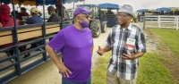 Professor Godfrey Uzochukwu, Ph.D., right, talks to a participant during a previous National Conference on Next-Generation Sustainable Technologies for Small-Scale Producers. This year's event will be held Monday, Sept. 9, at the N.C. A&T University Farm 