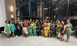 Beverly Hills West (CA) Chapter Members gather at the Green & White Reception; President Zna Portlock Houston is pictured front row, center.