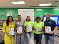 Pembroke Park Mayor Ashira Mohammed (far left), West Park Mayor Felicia Brunson (left), FPL volunteers Christine Shaw and Darlyne Jean-Charles (center) and Broward Ed.  volunteer James Knapp (right)