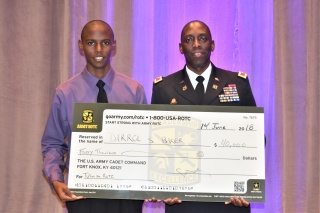 PHOTO/CAPTION #2: (L) The U.S. Army presented a college scholarship to Cadet Darrol Baker (L) in the amount of $40,000; presented by Col. Farrell Duncombe at the Salute to Youth Luncheon during the 100 Black Men, Inc. Conference.