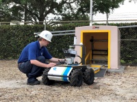 FPL Substation Robot 3: FPL engineer and innovator Michael Gilbertson examines the company's first ever substation robot installed in Miami-Dade County. 