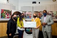 David I Muir and Calibe Thompson of Island SPACE receive a $10,000 check from Donna Callender and Derrick Reckord of GraceKennedy USA LLC. | Photo: RJ Deed