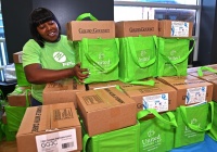 Florida Power & Light Company (FPL) Community Relations Specialist Darlyne Jean-Charles organizes hurricane preparedness meal kits to distribute to homebound seniors in Miami-Dade County.